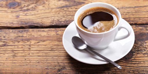 cup of coffee on wooden table
